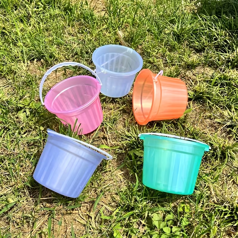 Two colorful, translucent mini buckets, handheld plastic buckets