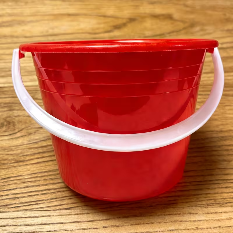 Mini red hand-held water bucket | Perfect for carrying water outdoors