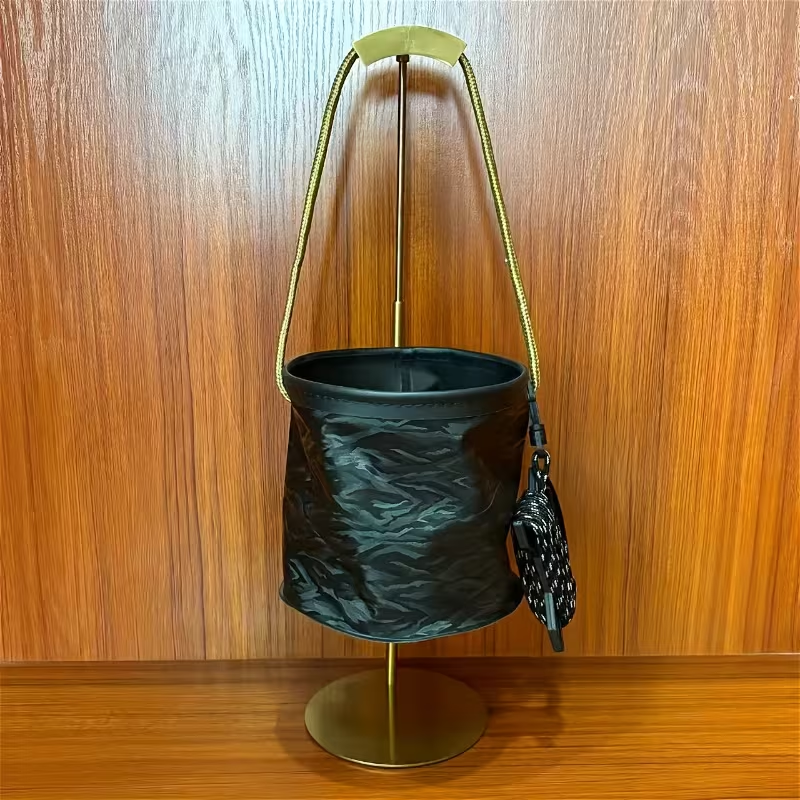 This collapsible bucket features a 3D design and is a portable plastic container.