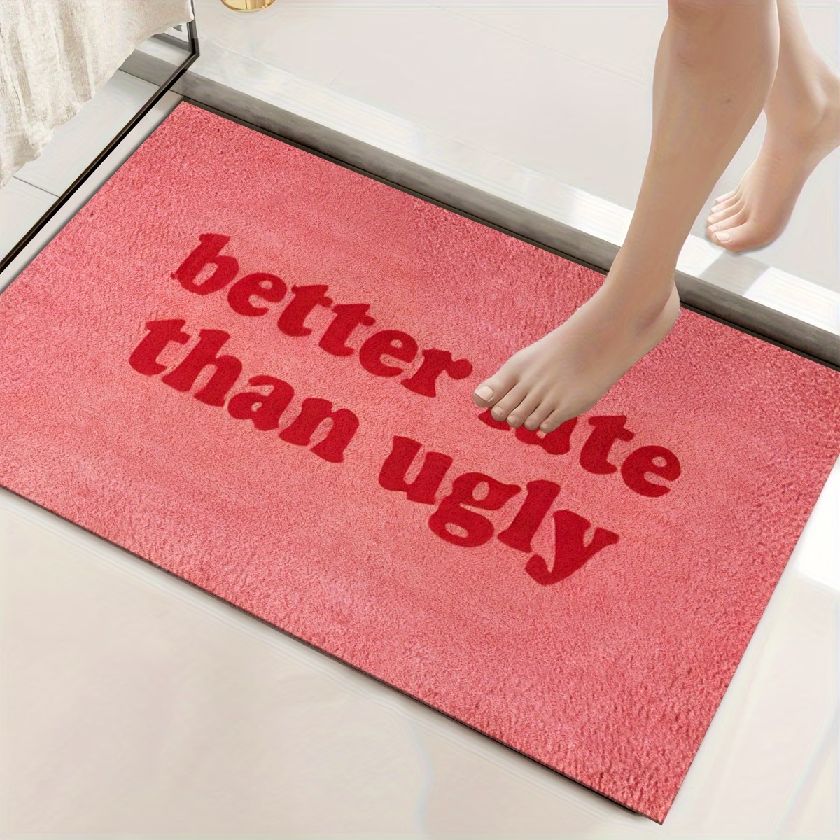 This stylish and fun "Better Late Than Ugly" printed felt floor mat