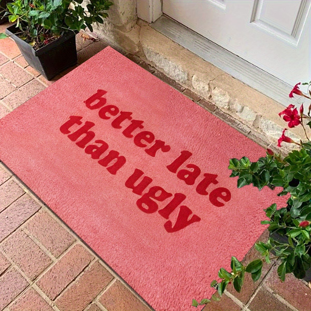 This stylish and fun "Better Late Than Ugly" printed felt floor mat