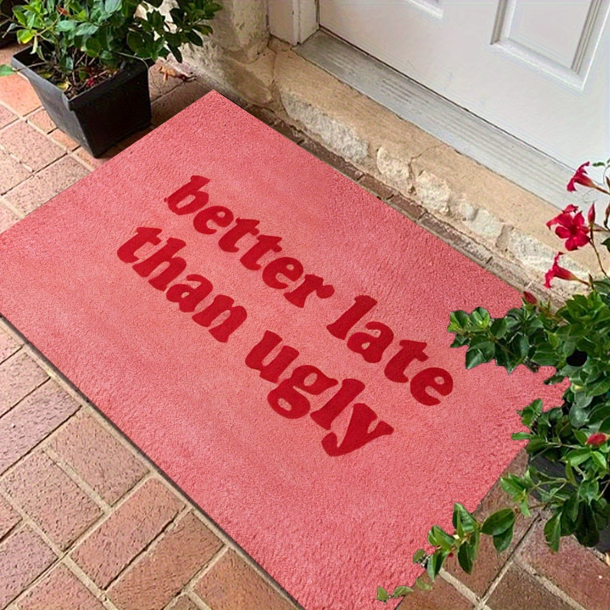 This stylish and fun "Better Late Than Ugly" printed felt floor mat