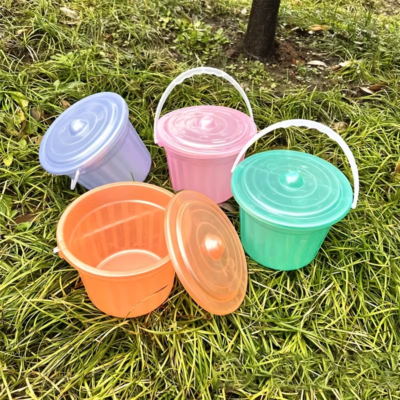 Two colorful, translucent mini buckets, handheld plastic buckets